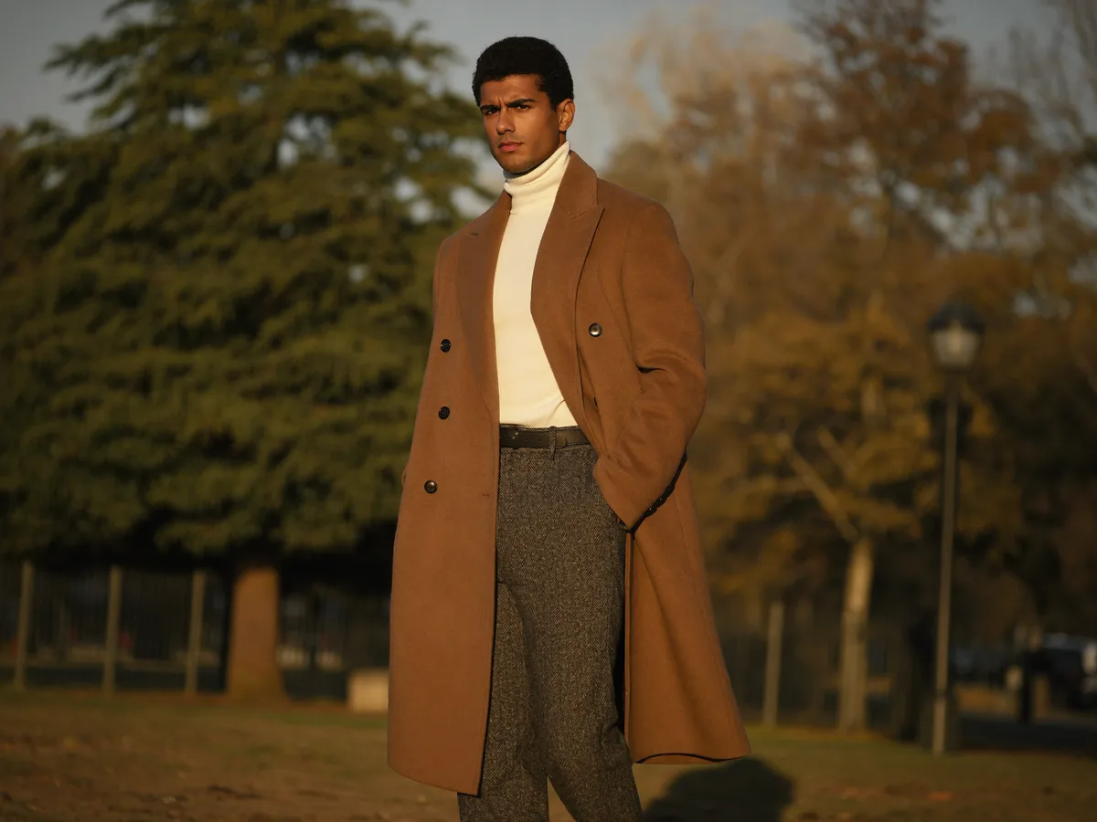Man confidently dressed, looking sharp in well-coordinated outfit, outdoor editorial